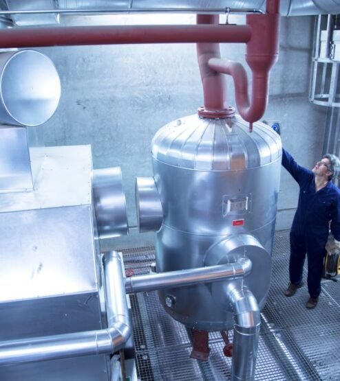 elevated-view-of-engineer-inspecting-machinery-in-2024-10-18-21-30-48-utc