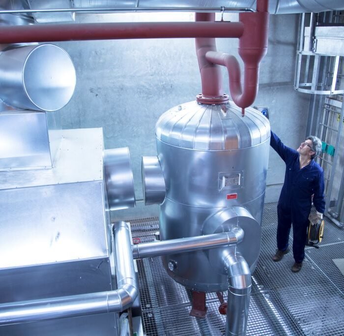 elevated-view-of-engineer-inspecting-machinery-in-2024-10-18-21-30-48-utc