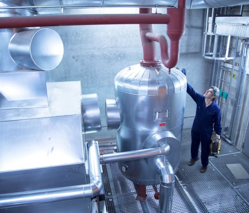 elevated-view-of-engineer-inspecting-machinery-in-2024-10-18-21-30-48-utc